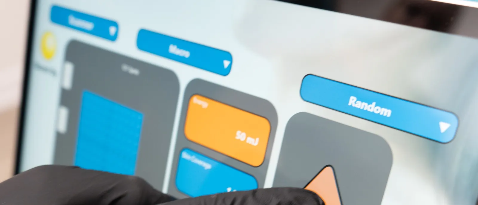 A gloved finger setting parameters on the Selene touchscreen