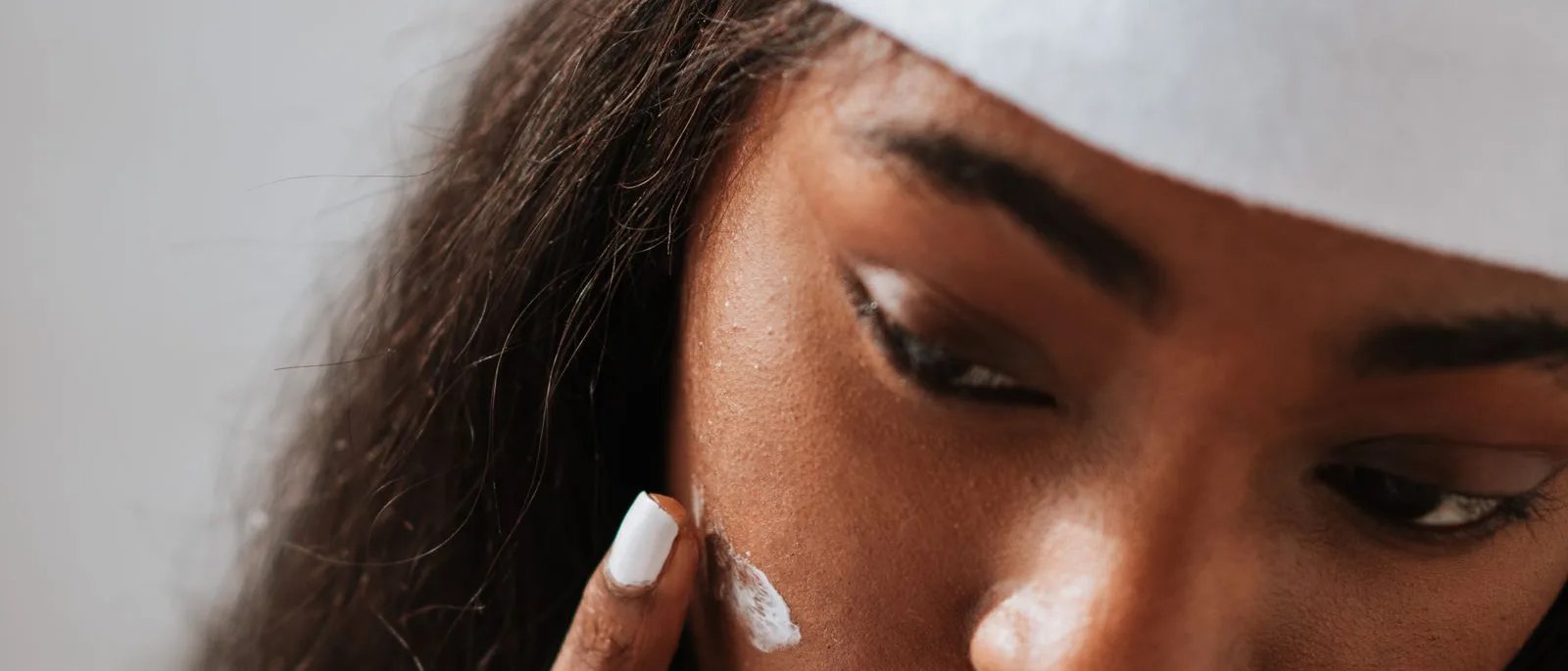 Post-treatment cream being applied to the skin
